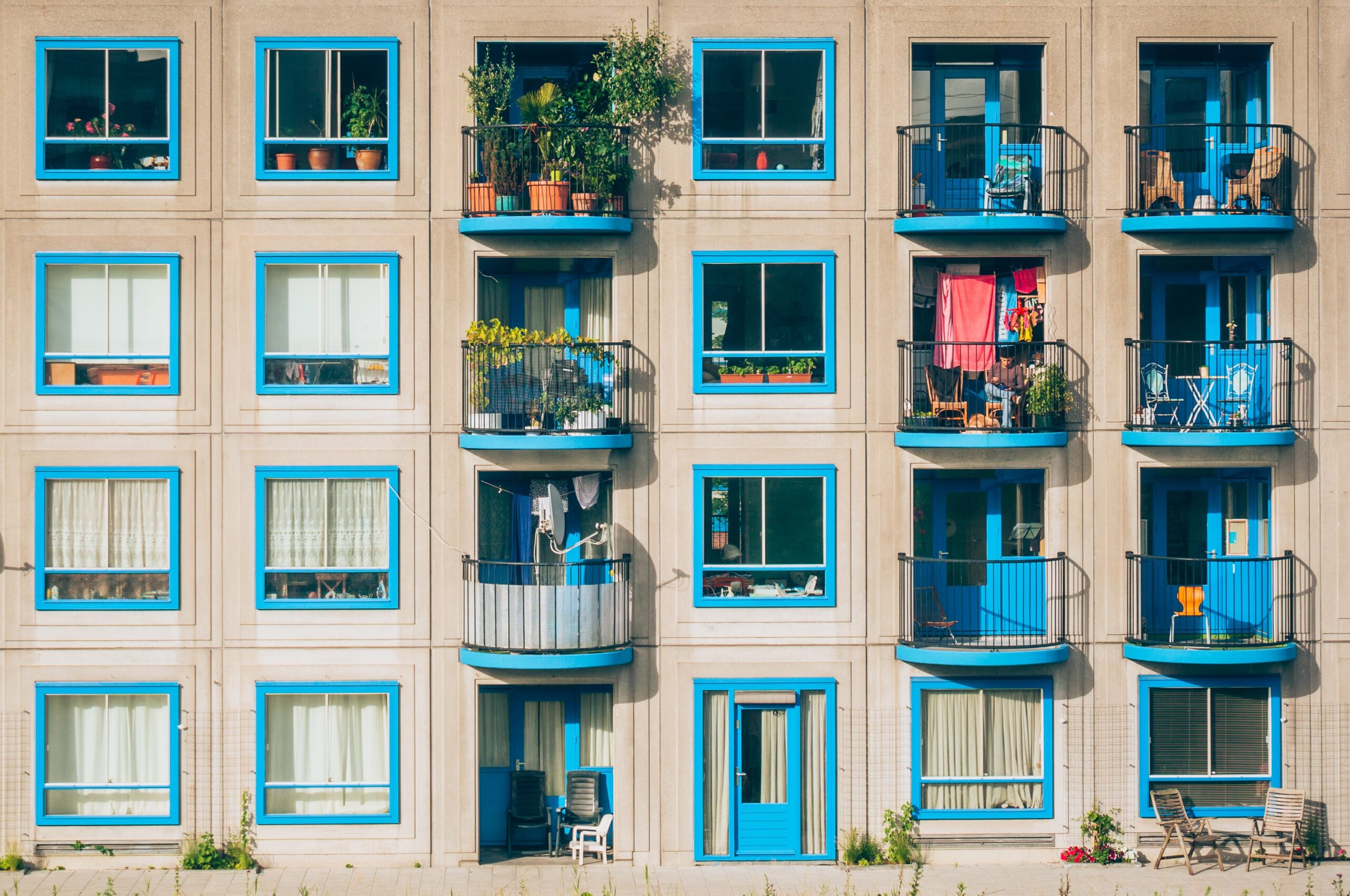 View of blue trimmed apartment building